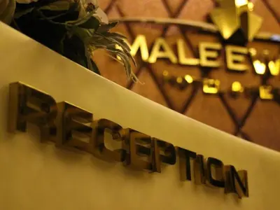 a sign for a market at Maleewana Hotel & Resort in Bang Yai