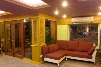 a living room with a couch in a building at Thai Garden Resort in Bangkok