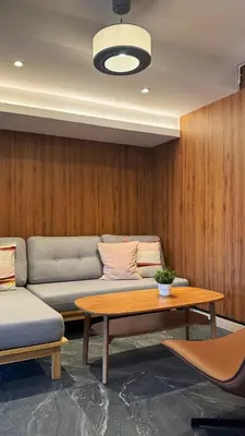 a living room with a couch and a table at Hyde Residence Ladprao48 in Bangkok