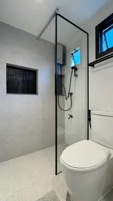 a bathroom with a toilet and a shower with a camera at Hyde Residence Ladprao48 in Bangkok