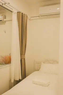 a bedroom with a white bed and a mirror at City Silom I King Bed I Sleep 3 I 2 Bedroom in Bangkok