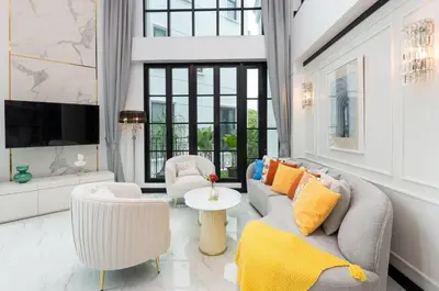 a living room with a couch and chairs and a table at Stylish 7Beds Poolhouse with Cinema Lift - 2min to BTS in Amphoe Phra Khanong
