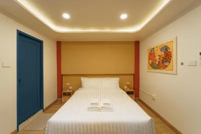 a bedroom with a bed with two towels on it at HAUS 924 l 5-Level Sanctuary in Ekkamai in Bangkok