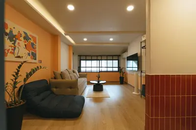 a living room with a couch and a chair at HAUS 924 l 5-Level Sanctuary in Ekkamai in Bangkok
