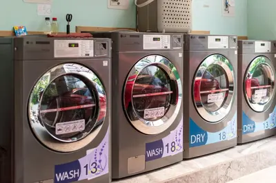 a row of washing machines in a store at Shizuka House - 500 m walk to BTS Phrom Phong in Bangkok