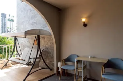 a room with a table and two chairs and a table at Shizuka House - 500 m walk to BTS Phrom Phong in Bangkok