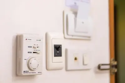 a close up of a door with an electrical outlet at Elite Home stays by UPAR, Silom in Bangkok