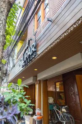 a store front with a bike parked outside of it at Elite Home stays by UPAR, Silom in Bangkok