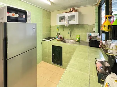 a kitchen with a refrigerator and a sink at Cozy Cat Souluna home in Ekkamai in Bangkok