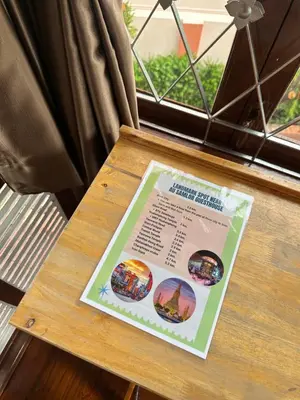 a table with a poster sitting on top of it at Au samlor guesthouse in Chinatown