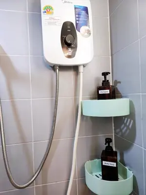 a bathroom with a soap dispenser on a wall at 804-STP Homely room Free Wi-Fi and Near BTS line in Bangkok