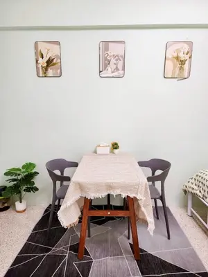 a dining room with a table and four chairs at 804-STP Homely room Free Wi-Fi and Near BTS line in Bangkok