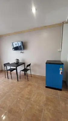 a room with a table and a blue box at Tawan Room#5 in Bangna