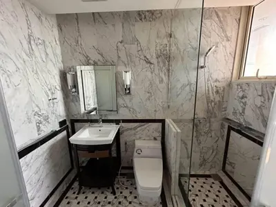 a bathroom with a toilet and a sink and a shower at Asia Mahanakhorn Travel in Bangkok