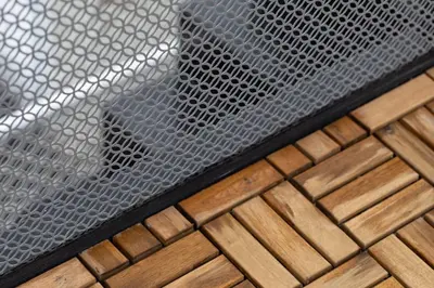 a metal grate on top of a wooden floor at Ease at Sathorn Hostel and Coworking Space in Bangkok