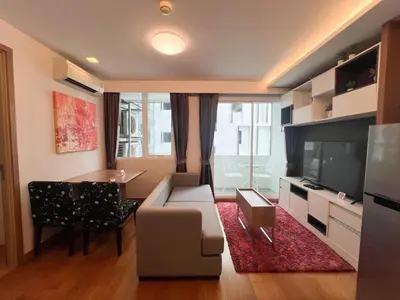 a living room with a couch and a table at Contemporary Premier 1BR - Ultra Fast Wifi - BTS Nana in Bangkok