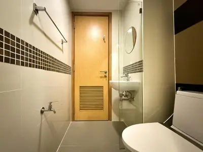 a bathroom with a toilet and a sink at Stylish Premier 1BR - Ultra Fast Wifi - BTS Nana in Bangkok