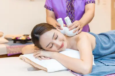 a woman getting her hair washed at a salon at Avana Bangkok Hotel & Convention Centre in Bangna