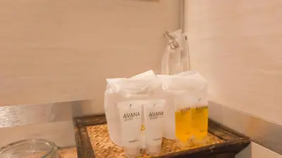 a tray with three bottles of beer on a counter at Avana Bangkok Hotel & Convention Centre in Bangna