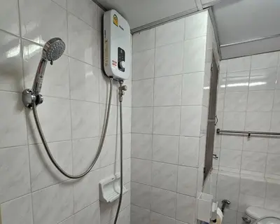 a shower with a shower head in a bathroom at City Living in Bangkok