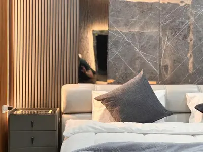a living room with a couch and a mirror at Delta9 Phrakanong 3 mins BTS Phrakanong in Bangkok