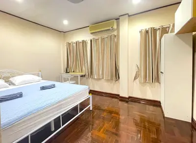 a hospital room with a bed and curtains at TheStarHome Sukhumvit71 in Bangkok