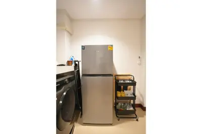 a kitchen with a refrigerator and a stove at 2BR 1BA Home In Yaowarat 5 Min MRT Nivas Wanit ECO in Bangkok