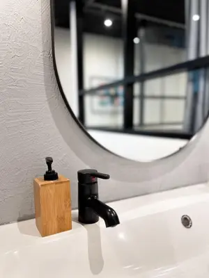 a bathroom sink with a faucet and a mirror at Rare Bangkok Townhouse Perfect for Groups, 8 mins to Train in Bangkok