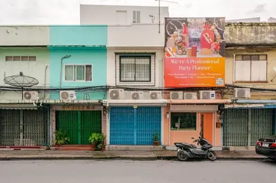 a scooter parked in front of a building at Rare Bangkok Townhouse Perfect for Groups, 8 mins to Train in Bangkok