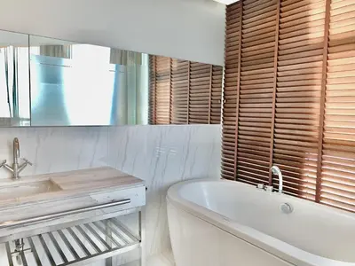 a white bathroom with a tub and a sink at Sathorn Prime Residence 2BR #Bangkok in Bangkok
