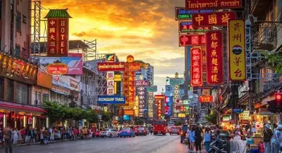 a busy street in an asian city with neon signs at Gallery house 177-3min walk BTS near icon siam in Bangkok