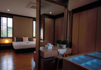 a hotel room with a bed and a tub at Studio Sukumvit 29 in Bangkok