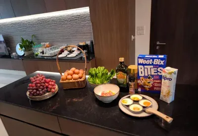 a kitchen counter with eggs and other food on it at Studio Sukumvit 29 in Bangkok
