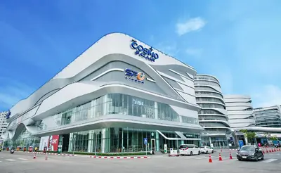 a large building with cars parked in front of it at 4 guests condo near Impact, Wi-Fi & washer C5 in Ban Bang Phang