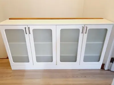 a white cabinet with glass doors in a room at Comfy Townhome 5min walk to 7-11 in Ban Nong Bua