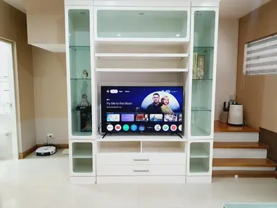 a white entertainment center with a tv in it at Comfy Townhome 5min walk to 7-11 in Ban Nong Bua
