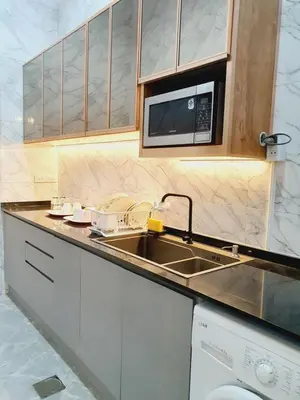 a kitchen with a sink and a microwave at Comfy Townhome 5min walk to 7-11 in Ban Nong Bua