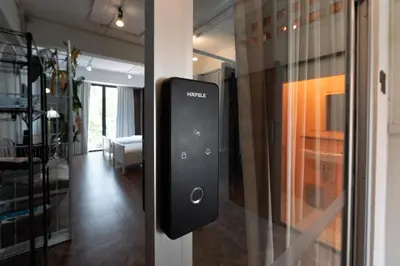 a close up of a door with a remote control on it at Rooftop at Ladprao The Mall Bangkapi BTS 4BR with Lift in Ban Bang Toei (1)