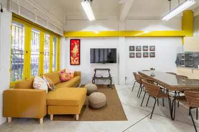 a living room with a couch and a table at Sao Chingcha Near Khao San Road MRT 3 bathtub in Bangkok