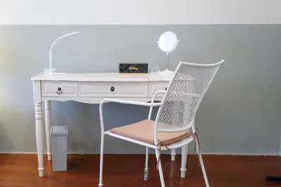 a white desk with a chair next to a white desk at HOME175 Peaceful 2BR near BTS & IconSiam in Bangkok