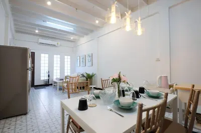 a kitchen and dining room with a table and chairs at HOME175 Peaceful 2BR near BTS & IconSiam in Bangkok