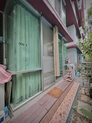 a front door of a house with green curtains at Condo In Bangkok With Pool and Garden in Sathani Ban Hua Mak