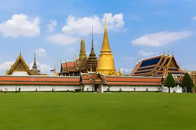 a palace with a green field in front of it at XX GO INN Asiatique Bangkok - โกอินน์ เอเชียทีค เจริญกรุง in Bangkok