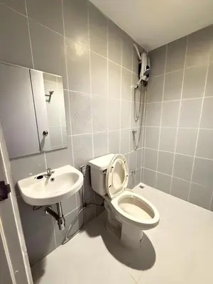 a bathroom with a toilet and a sink at XX Stay On Sukhumvit Soi 11 BTS Nana Pro in Makkasan