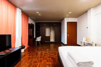 a bedroom with a bed and a television in it at XX Stay On Sukhumvit Soi 11 BTS Nana Pro in Makkasan