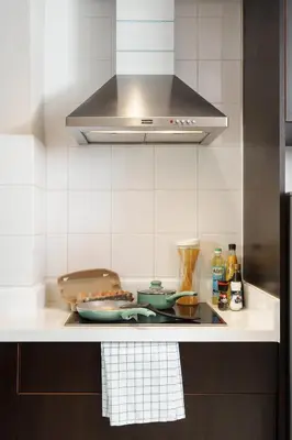 a kitchen with a stove top with two bowls on it at Azure Dreams King Suite Retreat near BTS & Fast WiFi in Khlong Toei