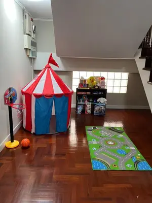 a childs play room with a tent and a floor at Urban Grace in Bangkok