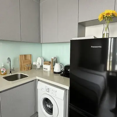 a kitchen with a washing machine and a sink at 2BR 2BA Luxury Lifestyle 5min walk Thonglor BTS in Bangkok
