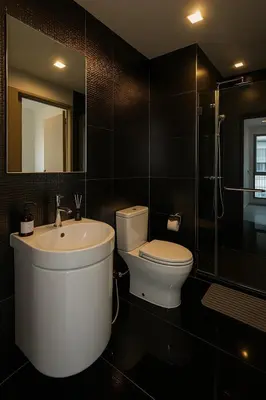 a bathroom with a toilet and a sink and a mirror at 2BR 2BA Luxury Lifestyle 5min walk Thonglor BTS in Bangkok