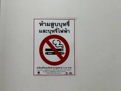 a no smoking sign is on a wall at Comfy1BR at Bangson byBB in Bangkok